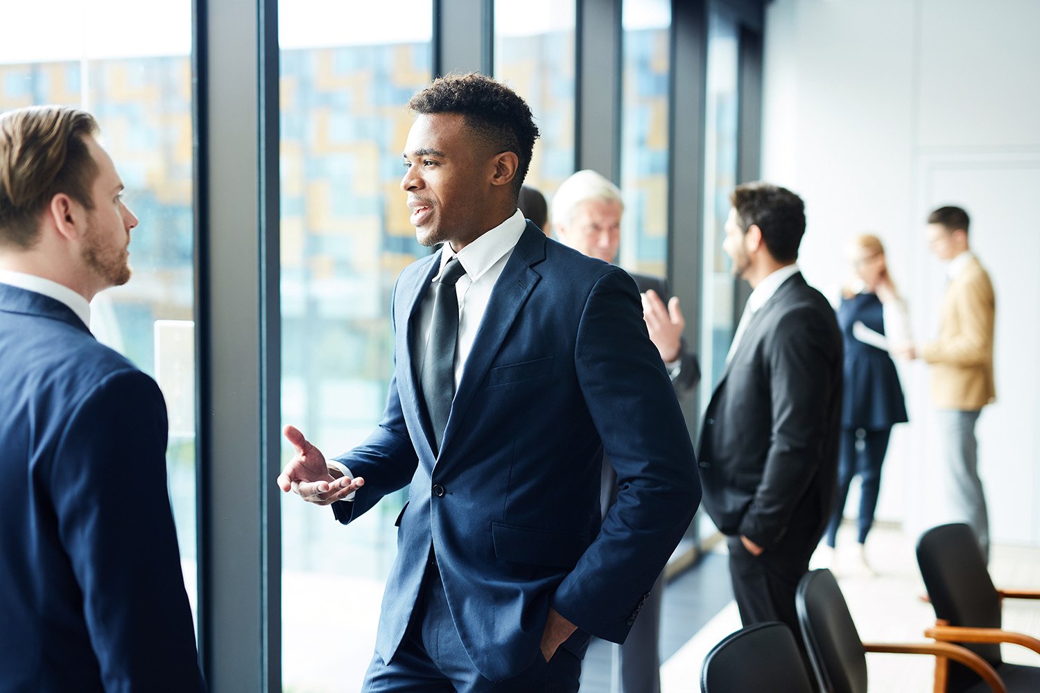 An image captured while doing event photography of a business team talking with each other