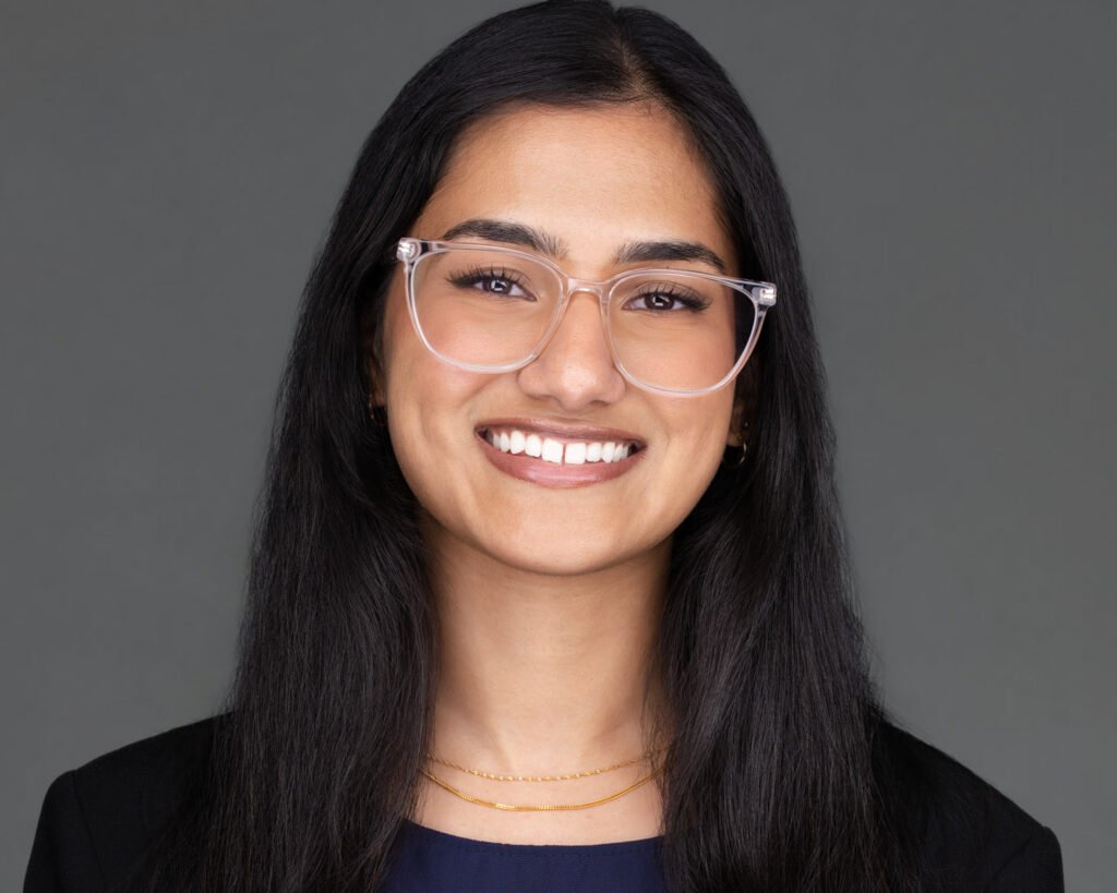 A professional business headshot of a woman