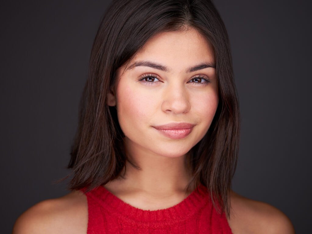 a picture of a model wearing red and black hair.