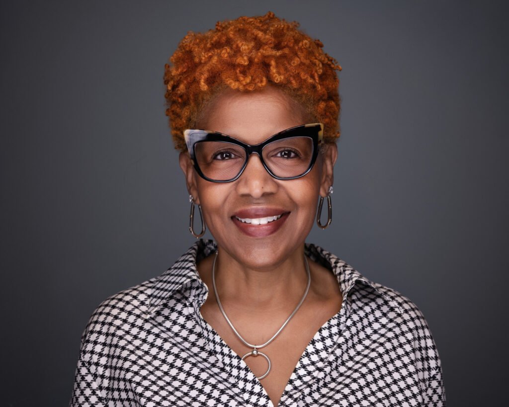 A professional headshot fort worth of a female with great glasses - 2mm Headshots & Event Photography Look Photogenic