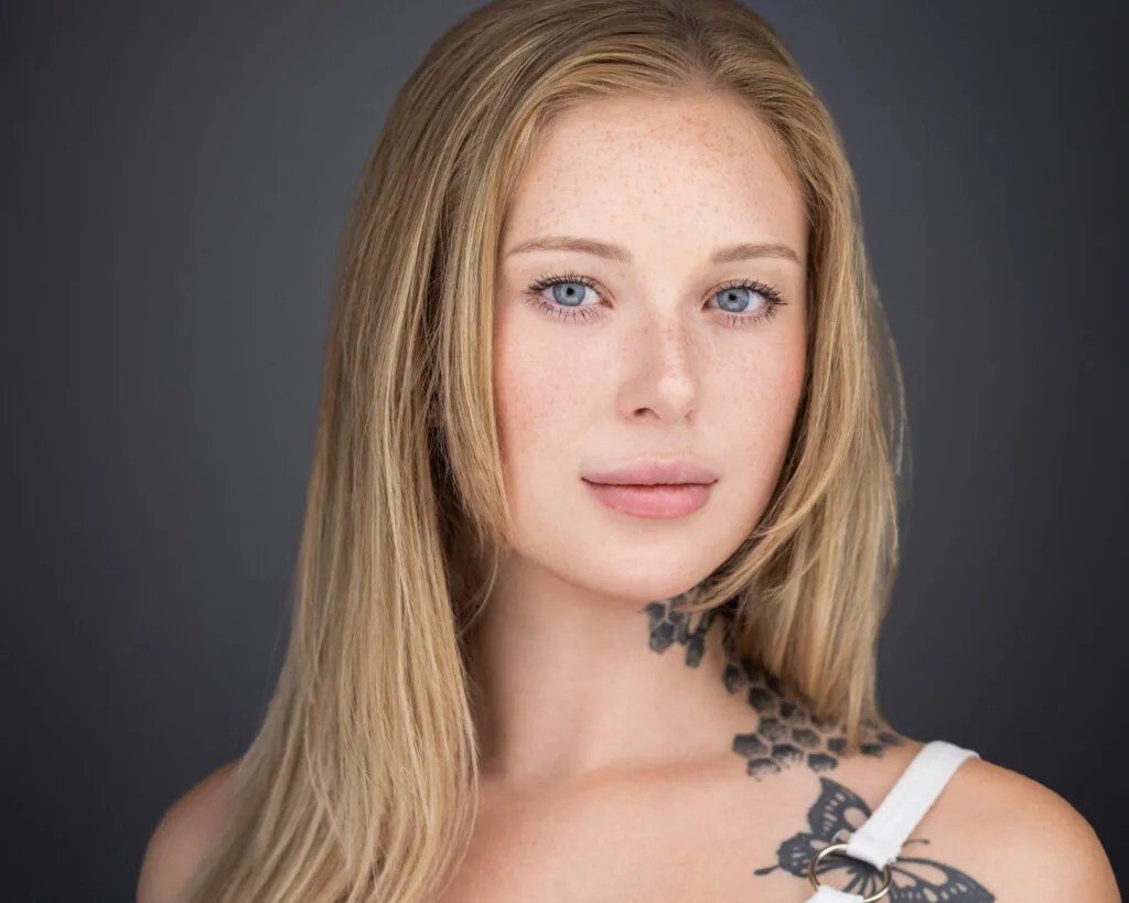 Acting headshot with natural expression and professional lighting.