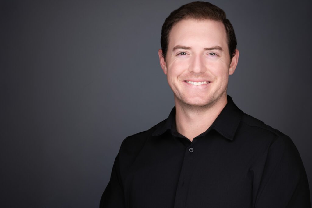 Consistent company headshots with matching backgrounds and lighting