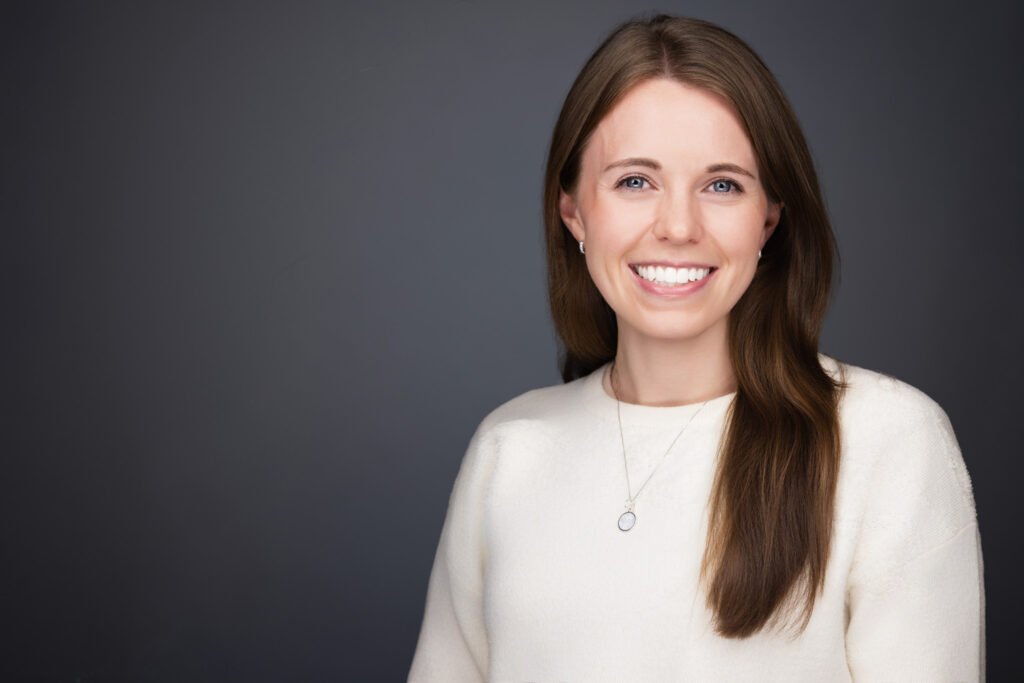 Branded conference headshot booth featuring sponsor logo
