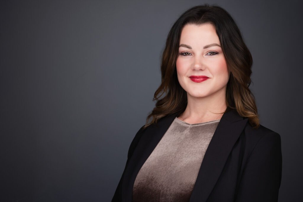 Executive headshot taken onsite in Keller with neutral backdrop and professional lighting