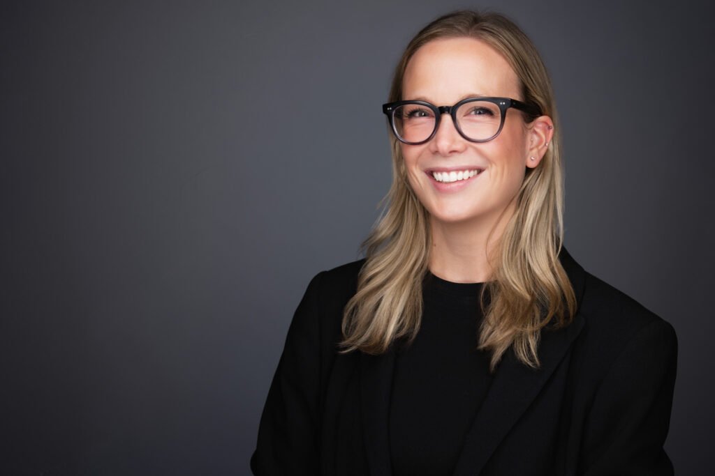 Executive being photographed during an on-site corporate headshot session