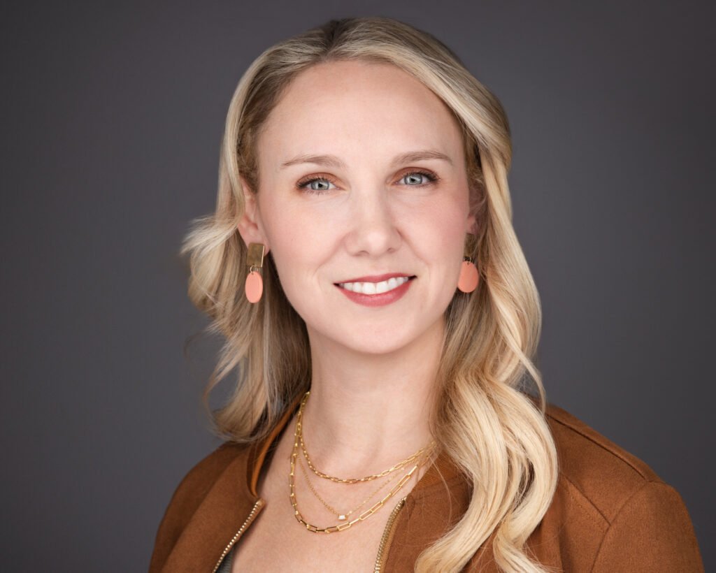 LinkedIn Headshot with Modern Clean Background - 2mm Headshots & Event Photography LinkedIn headshot with neutral grey background for business profile use.