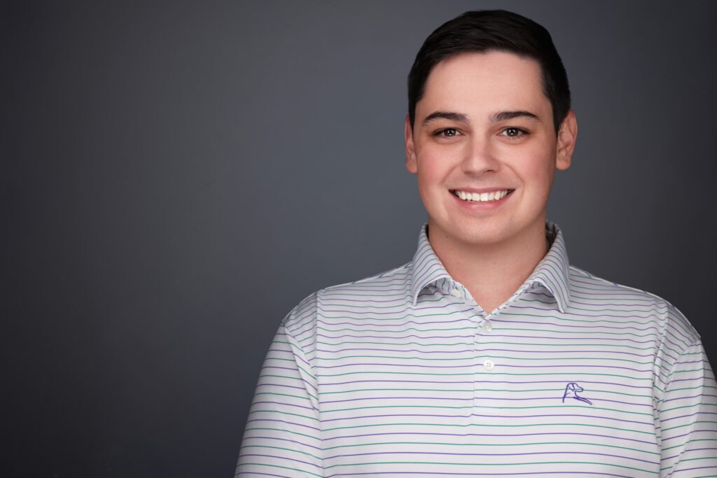 Retouched professional corporate headshot with natural skin texture