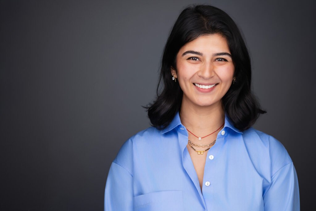 Executive headshot with deep blue background in Southlake TX